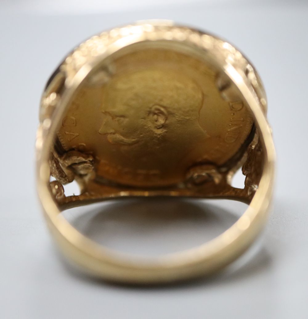 A George V 1912 gold sovereign, now in 9ct gold ring mount, size Q, gross 14.1 grams.